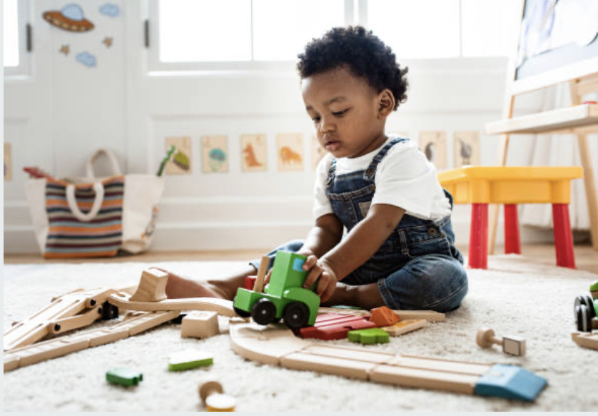 Child plays with toys